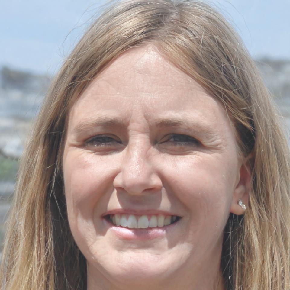 Astrid Moller, Project Implementation Specialist, reviewing system configuration